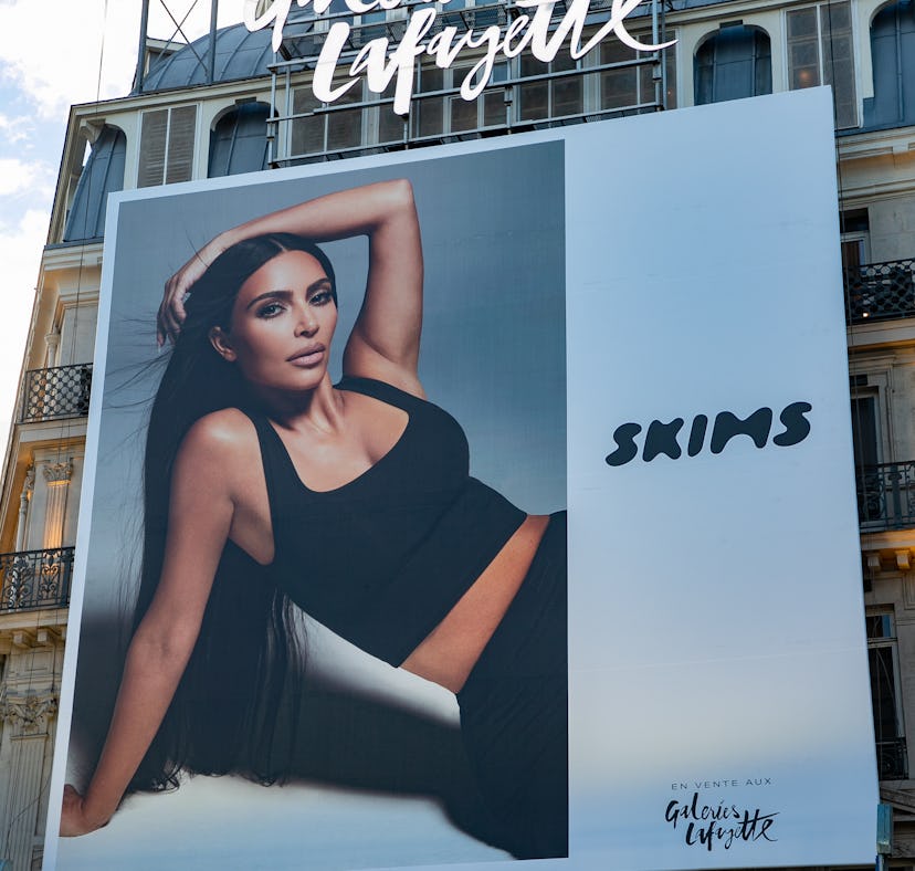 A SKIMS poster of Kim Kardashian West. The brand is having a Black Friday 2021 sale.