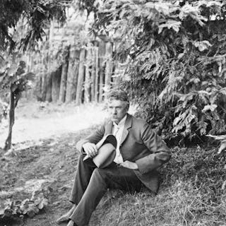 (Original Caption) American author and journalist Ambrose Bierce. Photograph, sitting under tree. Un...