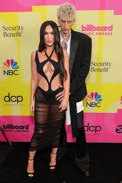 LOS ANGELES, CALIFORNIA - MAY 23: Megan Fox and Machine Gun Kelly poses backstage for the 2021 Billb...