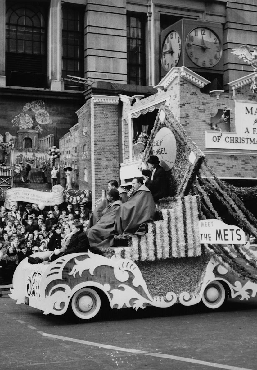 Baseball manager Casey Stengel (1890 - 1975) sits atop the 'Meet The Mets' parade float, during the ...