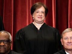 Associate Justice Elena Kagan (C), with Associate Justice Clarence Thomas (L) and Chief Justice John...