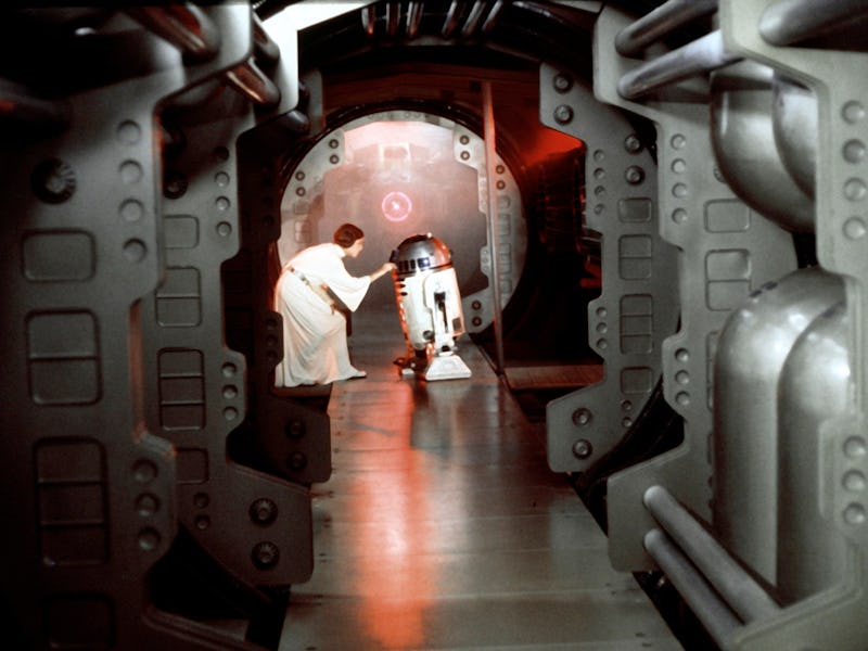 American actress Carrie Fisher and British actor Kenny Baker on the set of Star Wars: Episode IV - A...