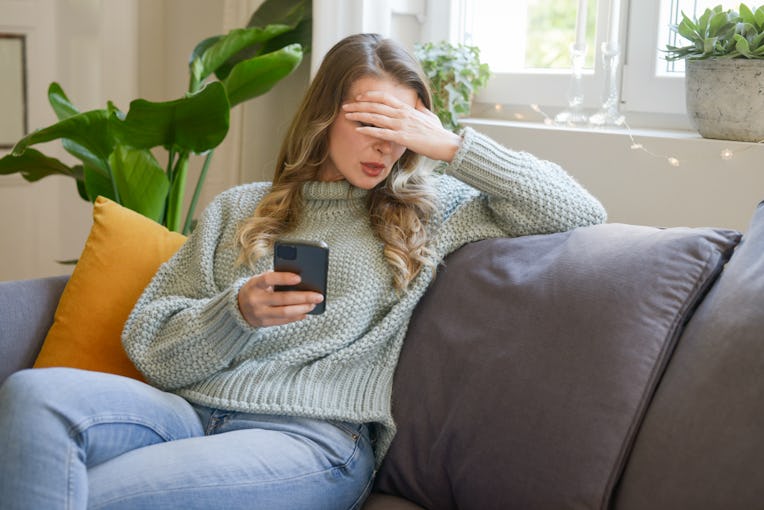 attractive middle aged woman sitting on the couch