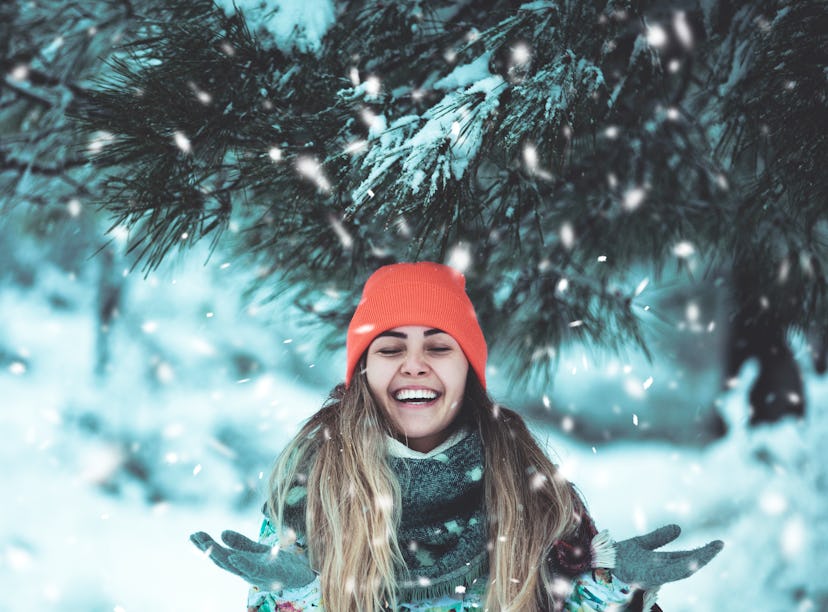 Woman playing in snow,  thinking about how December 13, 2021 will be the best week for her zodiac si...