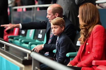 Prince George gets a lesson on sports from his dad. 