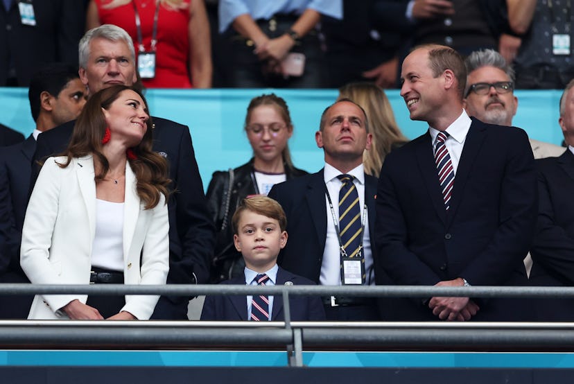 Prince George ignores a cute moment between his parents. 