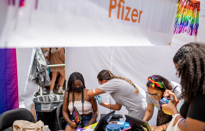 A woman gets vaccinated with the Pfizer vaccine during the New York Pride Fest