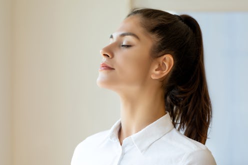 Woman standing by window