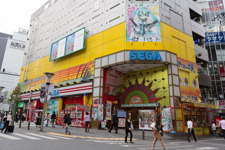 "Tokyo, Japan - September 28, 2012: Pedestrians walk past Sega Game Arcades. It is located in 1-21-1...