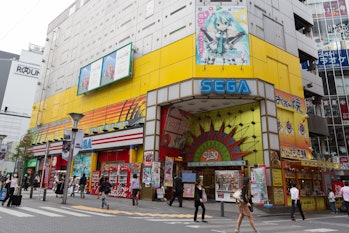 "Tokyo, Japan - September 28, 2012: Pedestrians walk past Sega Game Arcades. It is located in 1-21-1...