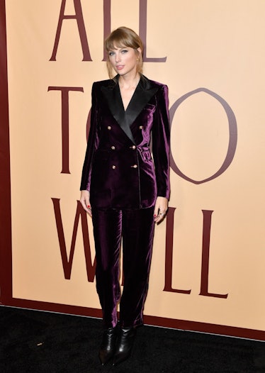 Taylor Swift at the "All Too Well" premiere in a dark purple velvet suit 