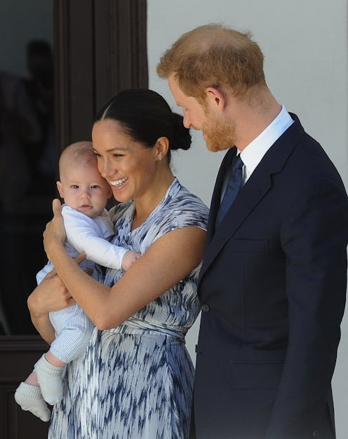 Britain's Duke and Duchess of Sussex, Prince Harry and his wife Meghan hold their baby son Archie as...