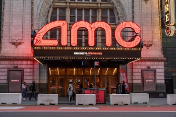 NEW YORK, NEW YORK - MARCH 09: People walk outside the AMC Empire 25 movie theater in Times Square a...