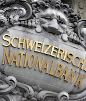 A sign for the Swiss National Bank is seen on the headquarters of the institution, in Bern, Switzerl...