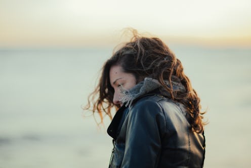 Worried thoughtful woman on windy day