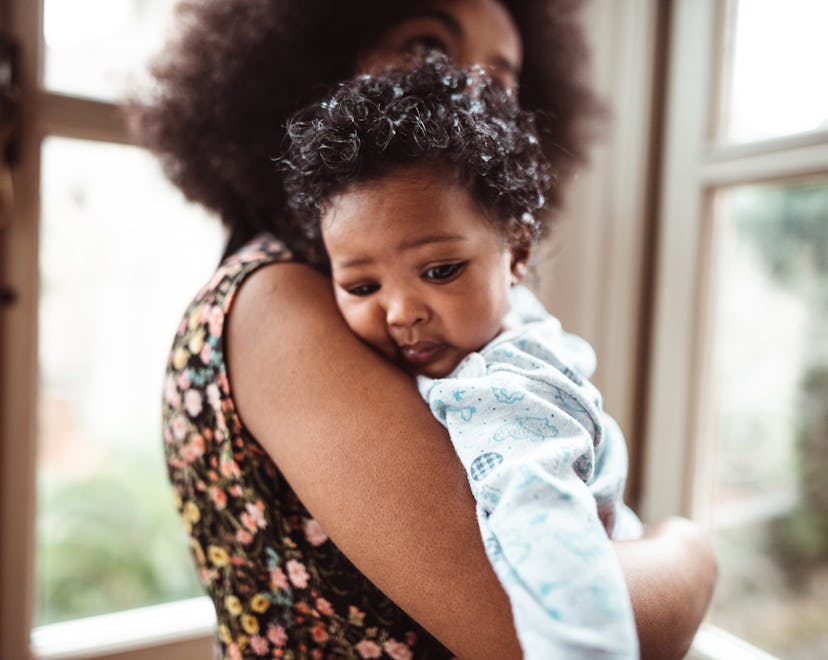 woman embracing her little kid