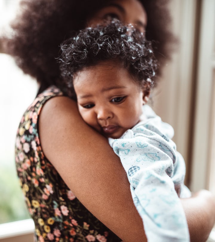 woman embracing her little kid