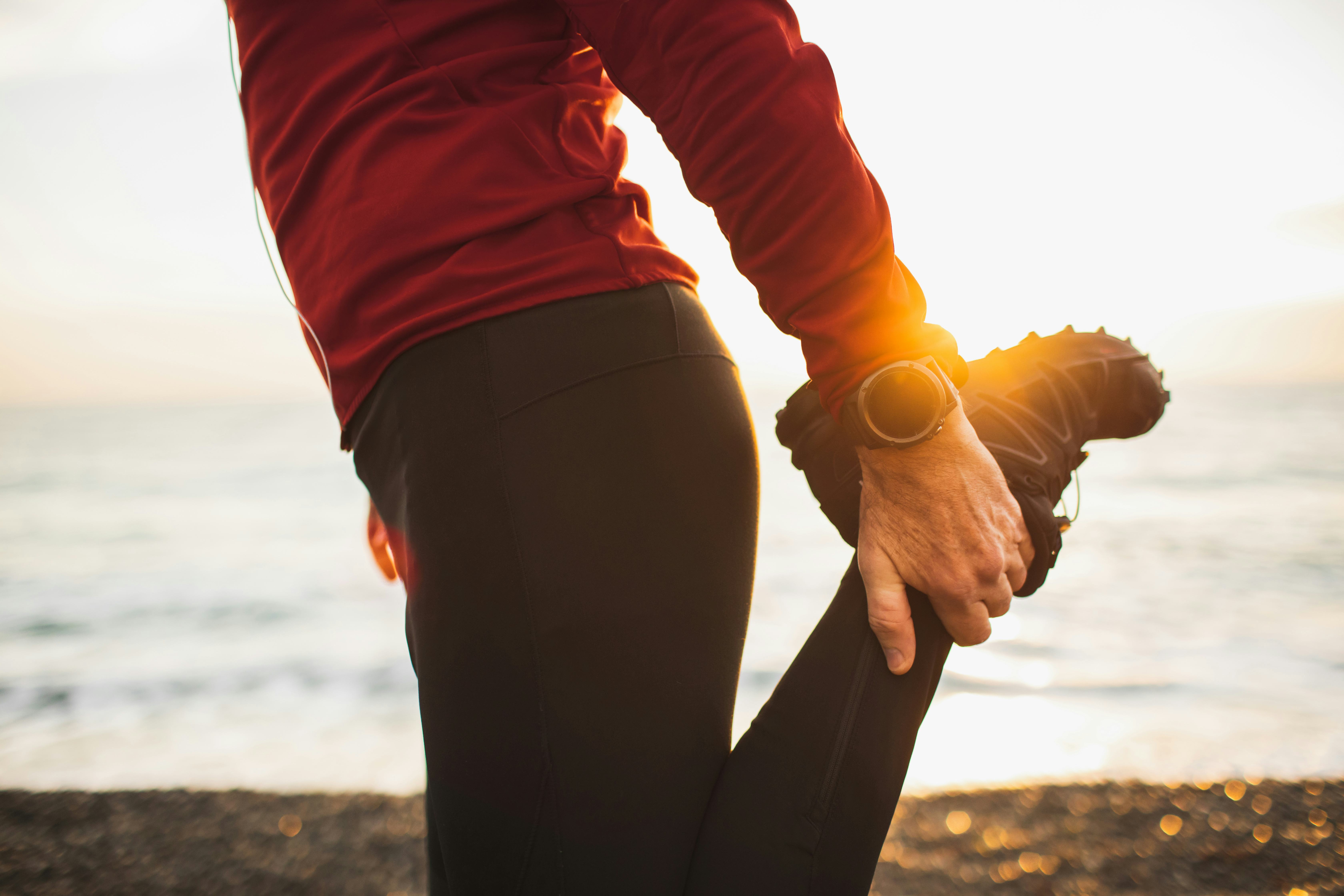 Smartwatches or fitness tracker on hand. Beautiful sun light on background. Active and healthy lifes...