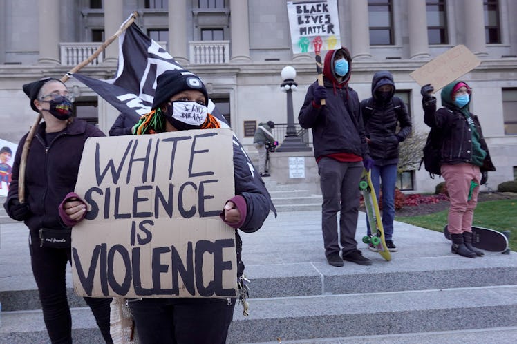 Demonstrators protest outside of the Kenosha County Courthouse as the jury listens to closing argume...
