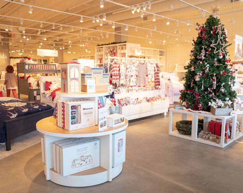 Interior image of a Pottery Barn Kids retail store decorated for the Christmas.