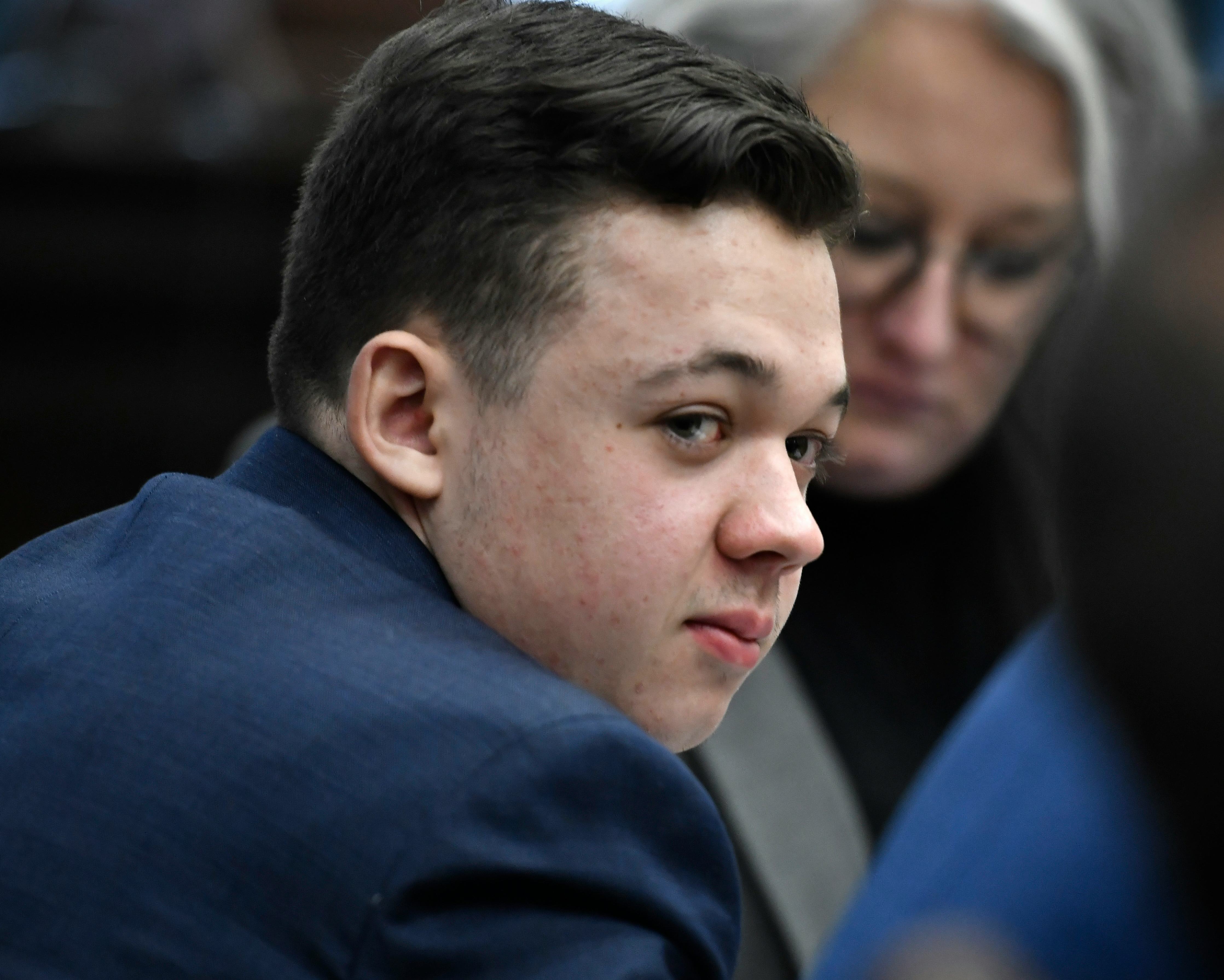 KENOSHA, WISCONSIN - NOVEMBER 15: Kyle Rittenhouse listens as the attorneys and the judge talk about...