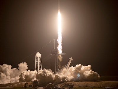 CAPE CANAVERAL, FLORIDA - NOVEMBER 10: SpaceX Falcon 9 rocket with the Crew Dragon spacecraft lifts ...