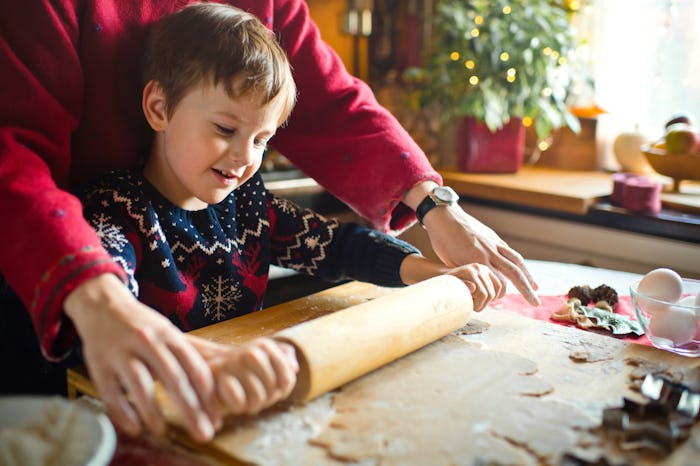 Family enjoying time together at home baking Xmas sweets