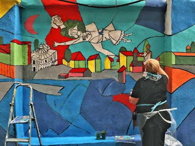 ODESA, UKRAINE - JUNE 16, 2021 - An artist works on a mural at the Migdal Jewish Centre on Mala Arna...