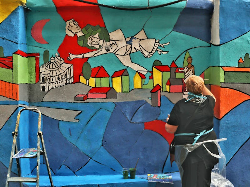 ODESA, UKRAINE - JUNE 16, 2021 - An artist works on a mural at the Migdal Jewish Centre on Mala Arna...