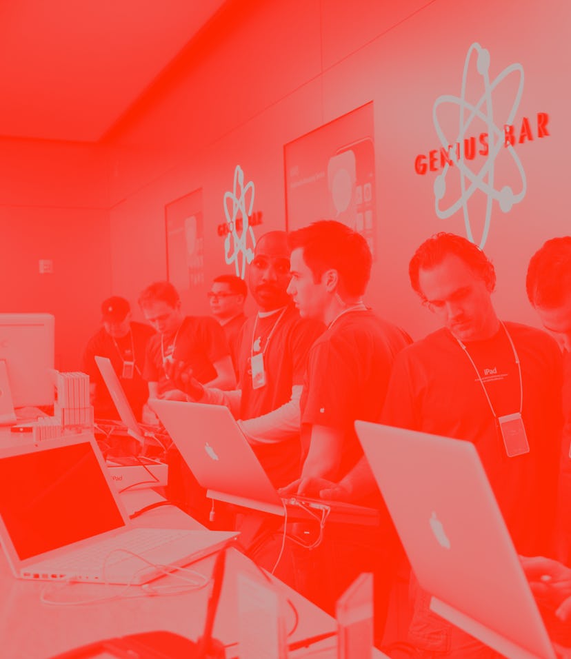 Apple employees work behind the Genius Bar at the Apple store in Bethesda, MD. (Photo by Brooks Kra...