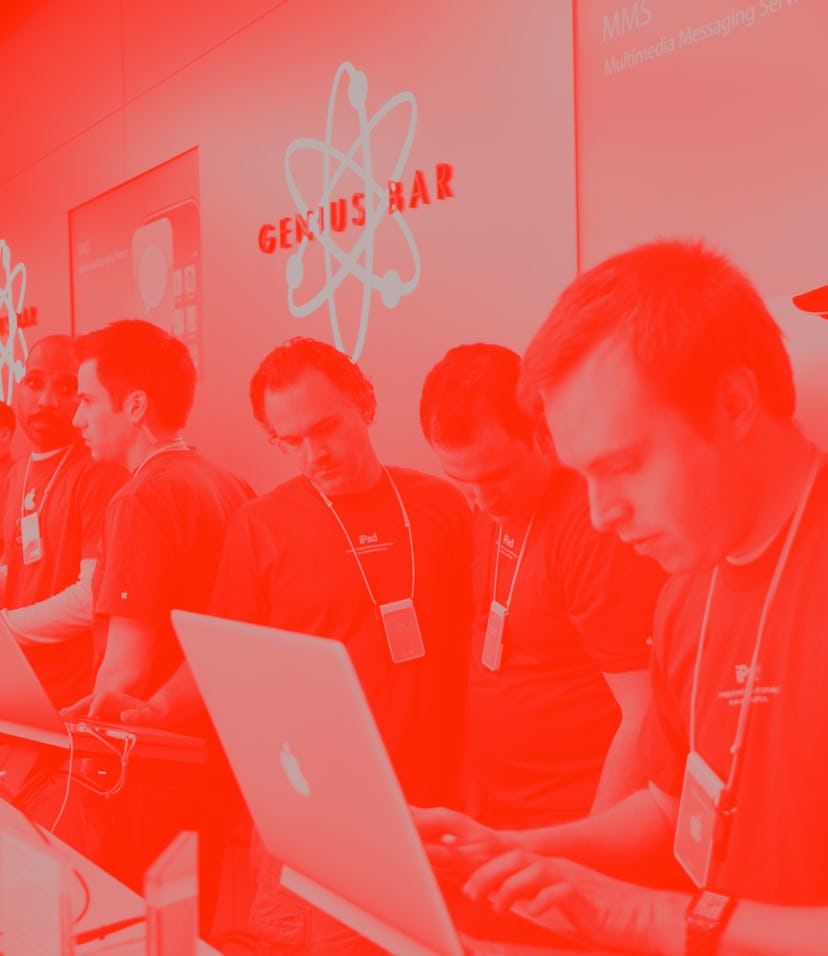 Apple employees work behind the Genius Bar at the Apple store in Bethesda, MD.  (Photo by Brooks Kra...