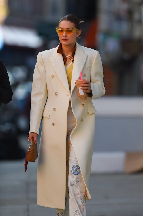 Gigi Hadid wears Mango, Reformation, Wardrobe.NYC, Loro Piana in 2021.