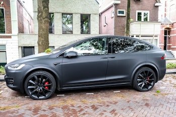 Tesla Model X electric SUV in matte black parked on the street in Zwolle, Netherlands. The Model X i...