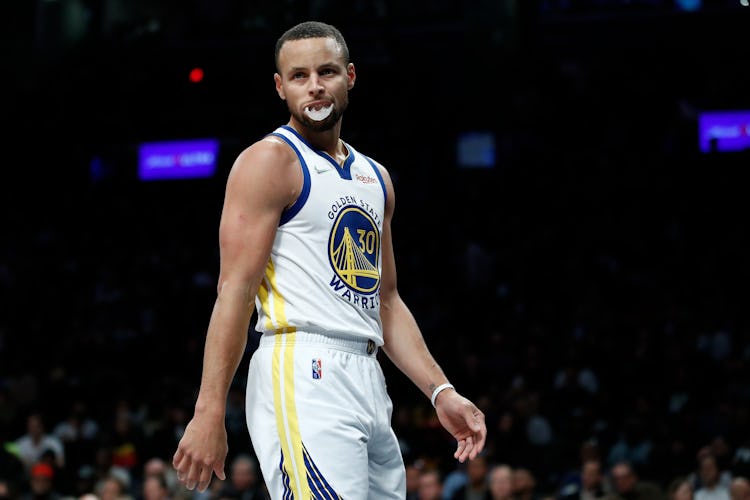 NEW YORK, NEW YORK - NOVEMBER 16: Stephen Curry #30 of the Golden State Warriors looks on during the...