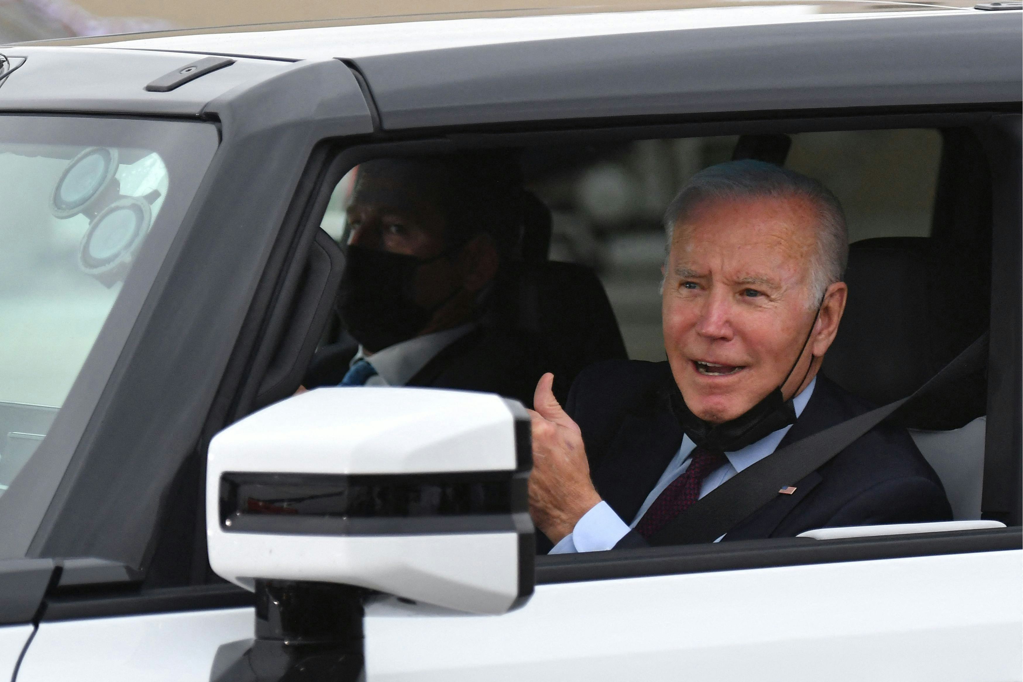 US President Joe Biden test drives an electric hummer as he tours the General Motors Factory ZERO el...