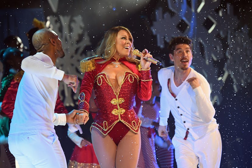 NEW YORK, NY - DECEMBER 05:  Mariah Carey (C) and dancers Anthony Burrell and Bryan Tanaka perform d...