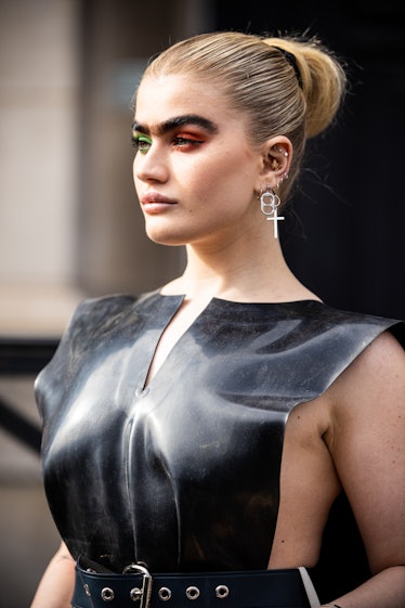 Sophia Hadjipanteli in green and red eyeshadow outside Vivienne Westwood fashion show.