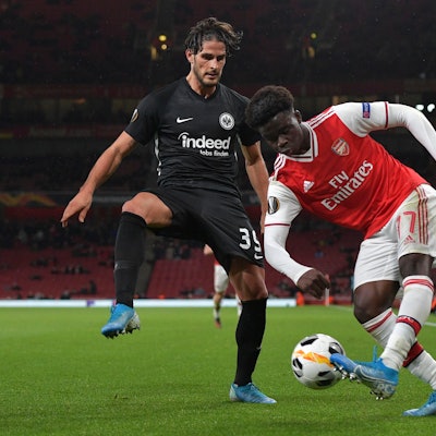 LONDON, ENGLAND - NOVEMBER 28: Bukayo Saka of FC Arsenal and Goncalo Paciencia of Eintracht Frankfur...