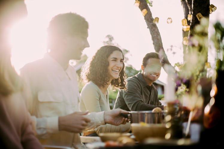A woman catches up with her friends during Thanksgiving Eve or Black Wednesday, which deserves a Bla...