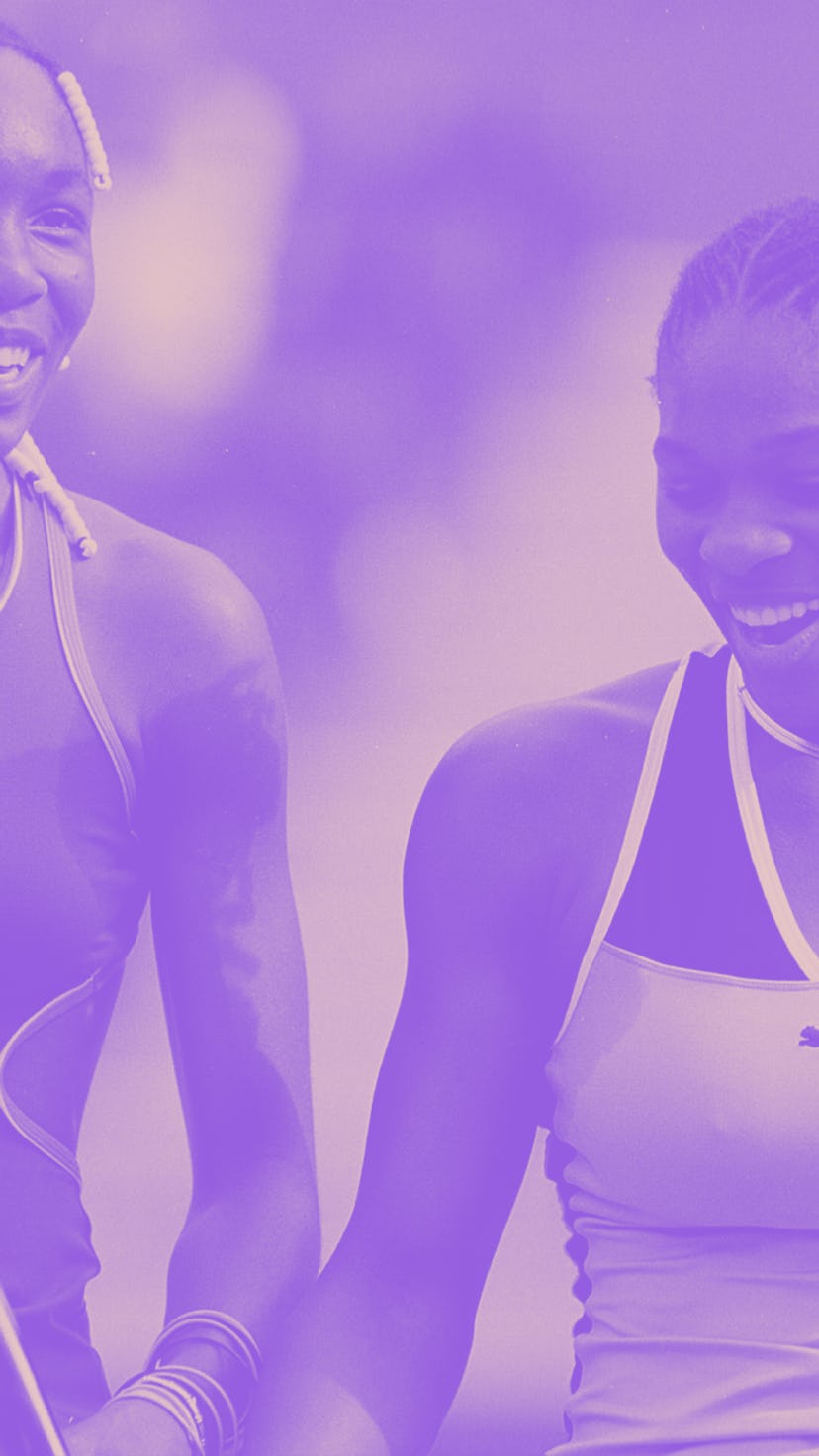 Venus Williams(L) and her sister Serena Williams share a light moment during a Women's Doubles match...