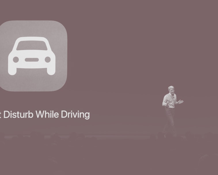 Apple's Senior Vice President of Software Engineering Craig Federighi speaks on stage about CarPlay ...