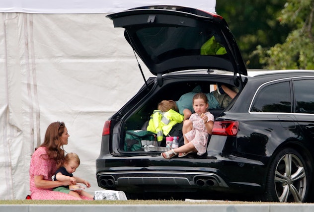 Prince George and Princess Charlotte dig through their car for snacks.