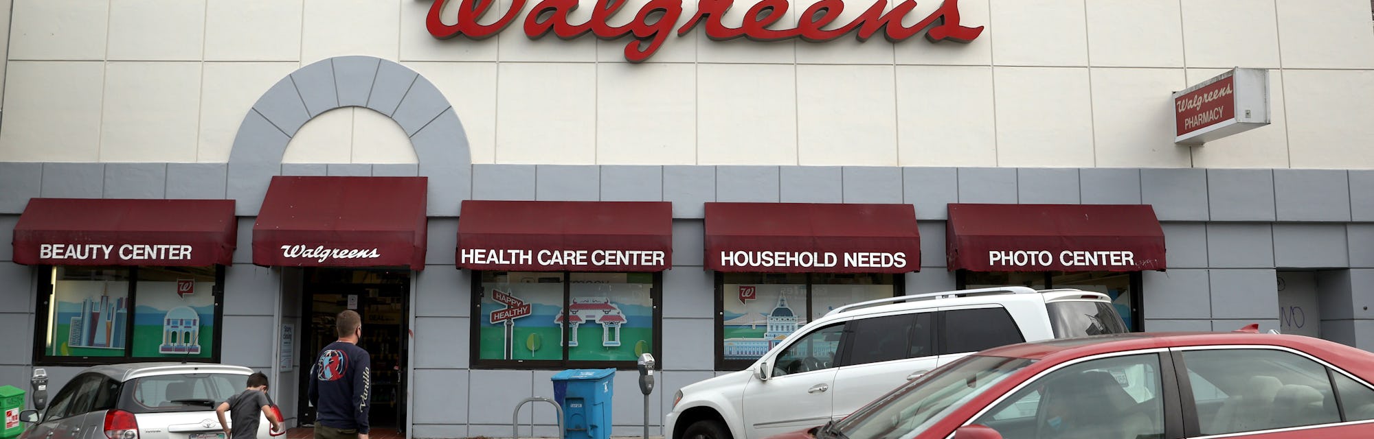 SAN FRANCISCO, CALIFORNIA - OCTOBER 13: Pedestrians walk by a Walgreens store that is set to be clos...