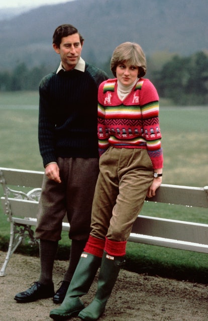 Prince Charles and Princess Diana both wearing sweaters. 