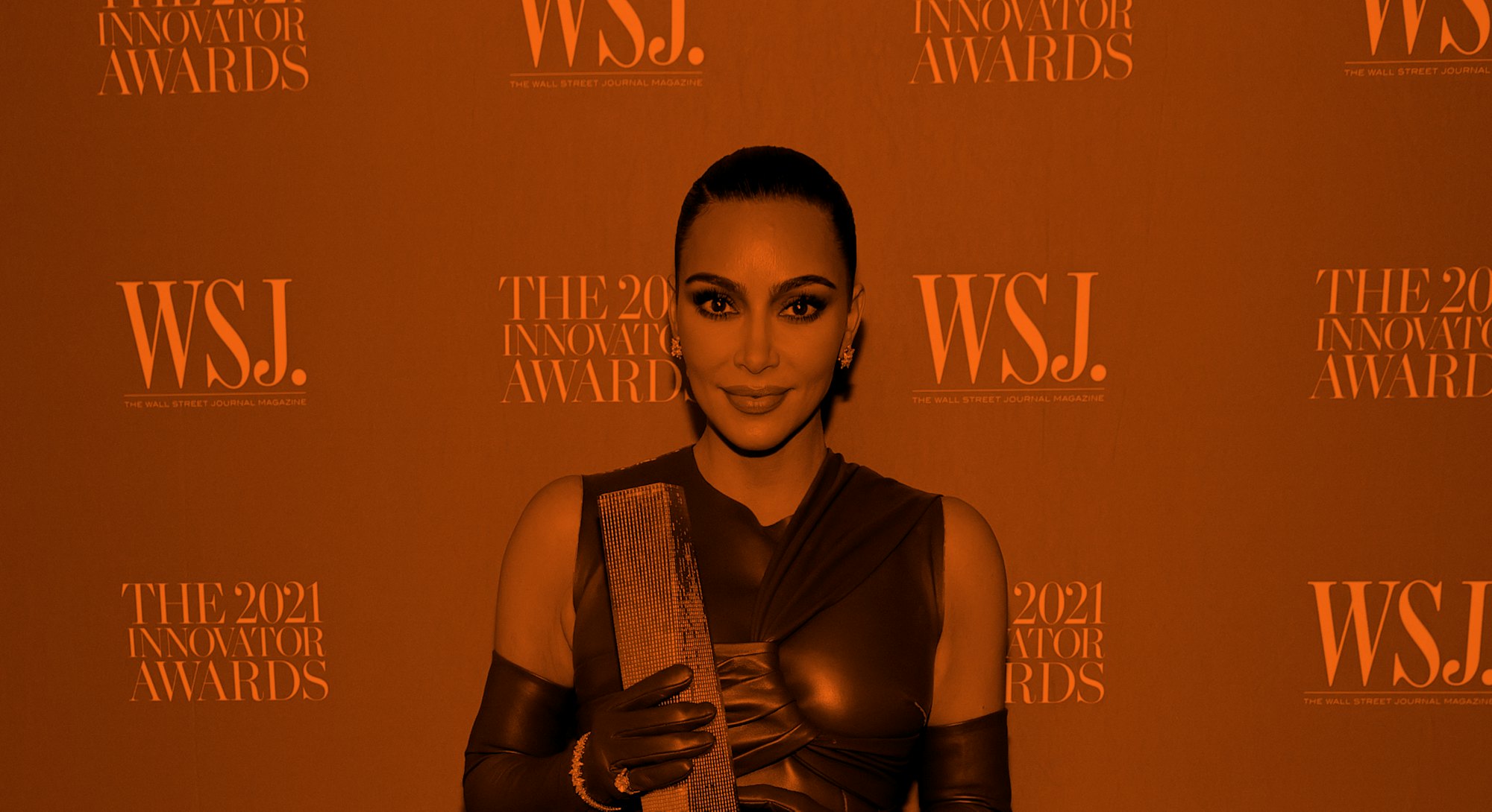 NEW YORK, NEW YORK - NOVEMBER 01: Kim Kardashian West poses with an award during the WSJ. Magazine 2...
