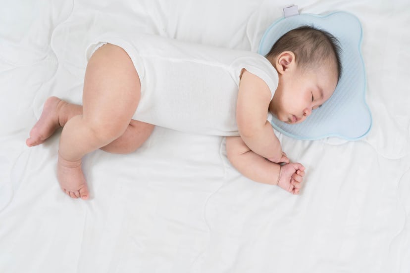 Baby boy sleeping in a crib