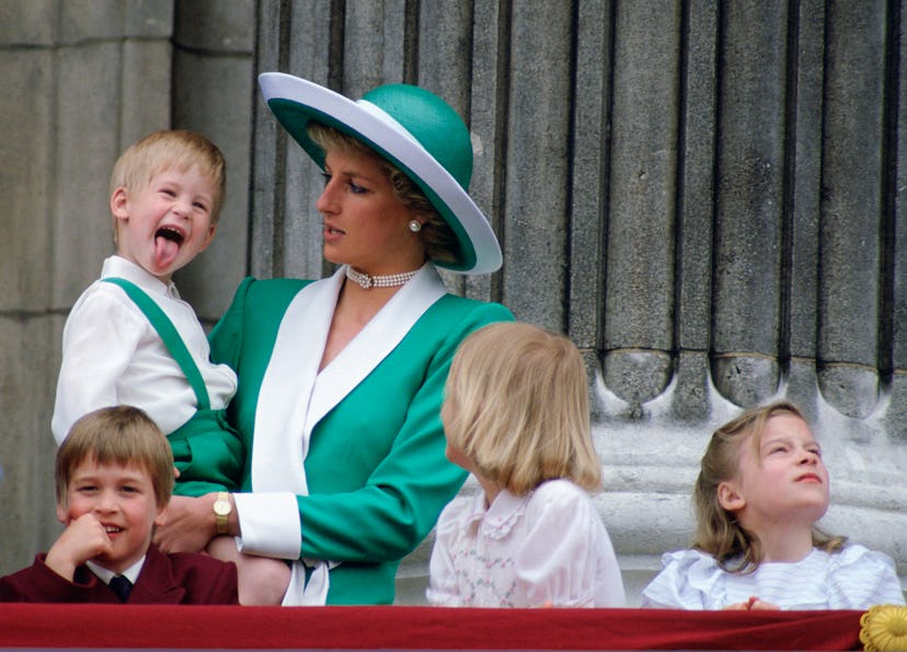Prince Harry sticks out his tongue.