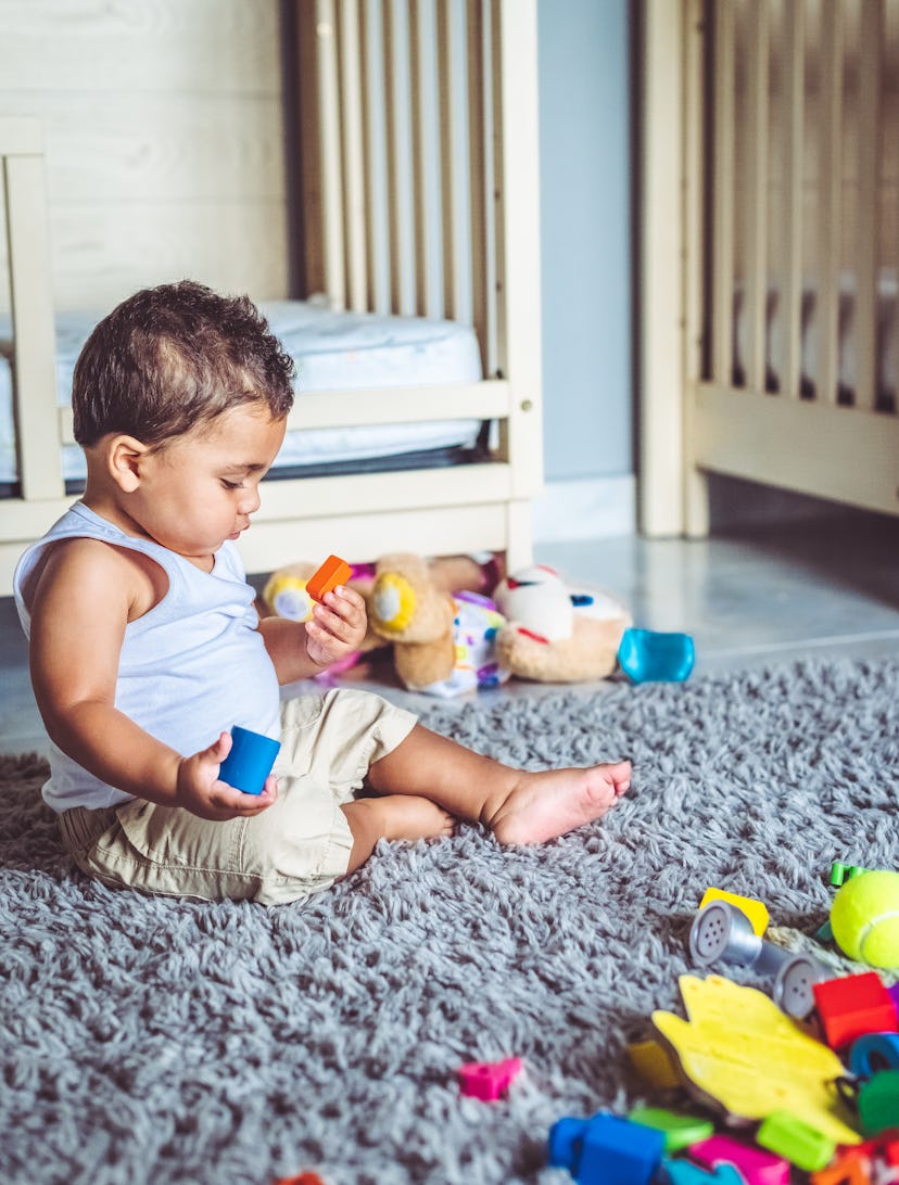 Baby boy playing with toys