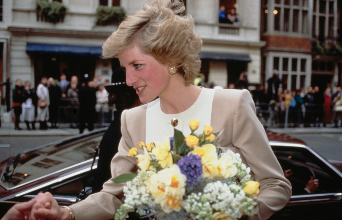 British Royal Diana, Princess of Wales (1961-1997), wearing a beige-and-white suit by Catherine Walk...