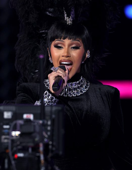 LOS ANGELES, CALIFORNIA - NOVEMBER 21: Host Cardi B speaks onstage during the 2021 American Music Aw...
